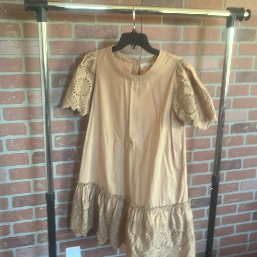 Easy dress to where anywhere.. always get a compliment on this lace tan dress